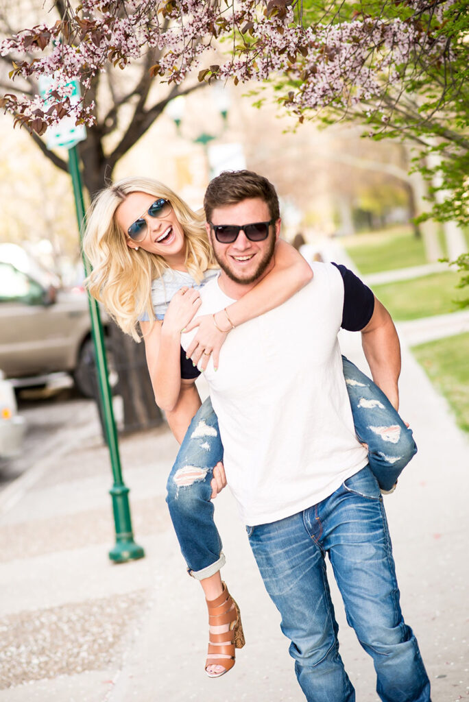 A man and woman are walking down the street